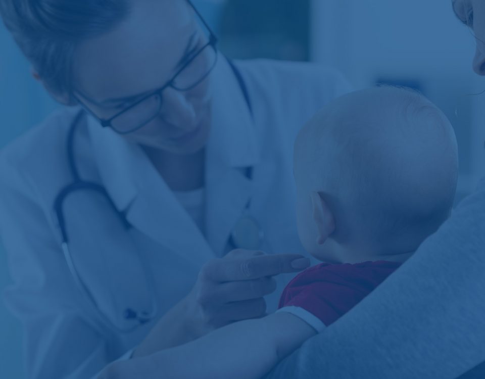 Female doctor examining a baby